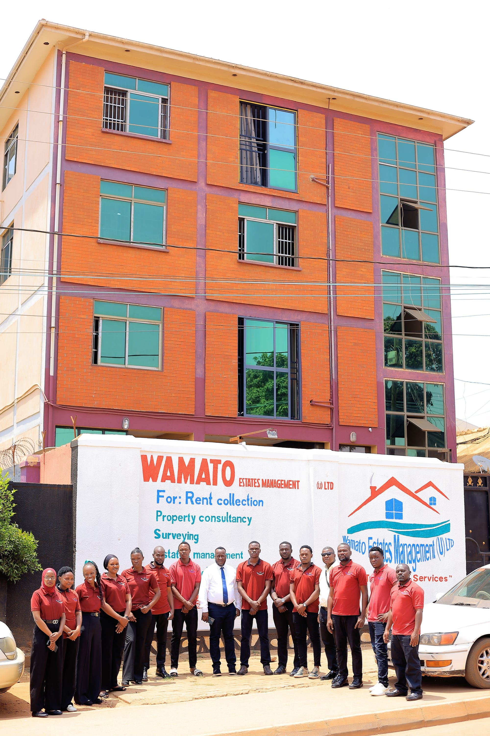 The Wamato Estates team outside their Lungujja office